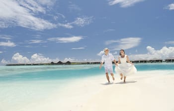 Couple on the beach of Paradise Island Resort & Spa Couple on the beach of Paradise Island Resort & Spa